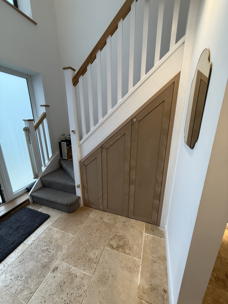 Bespoke under-stair storage with pull-out drawers