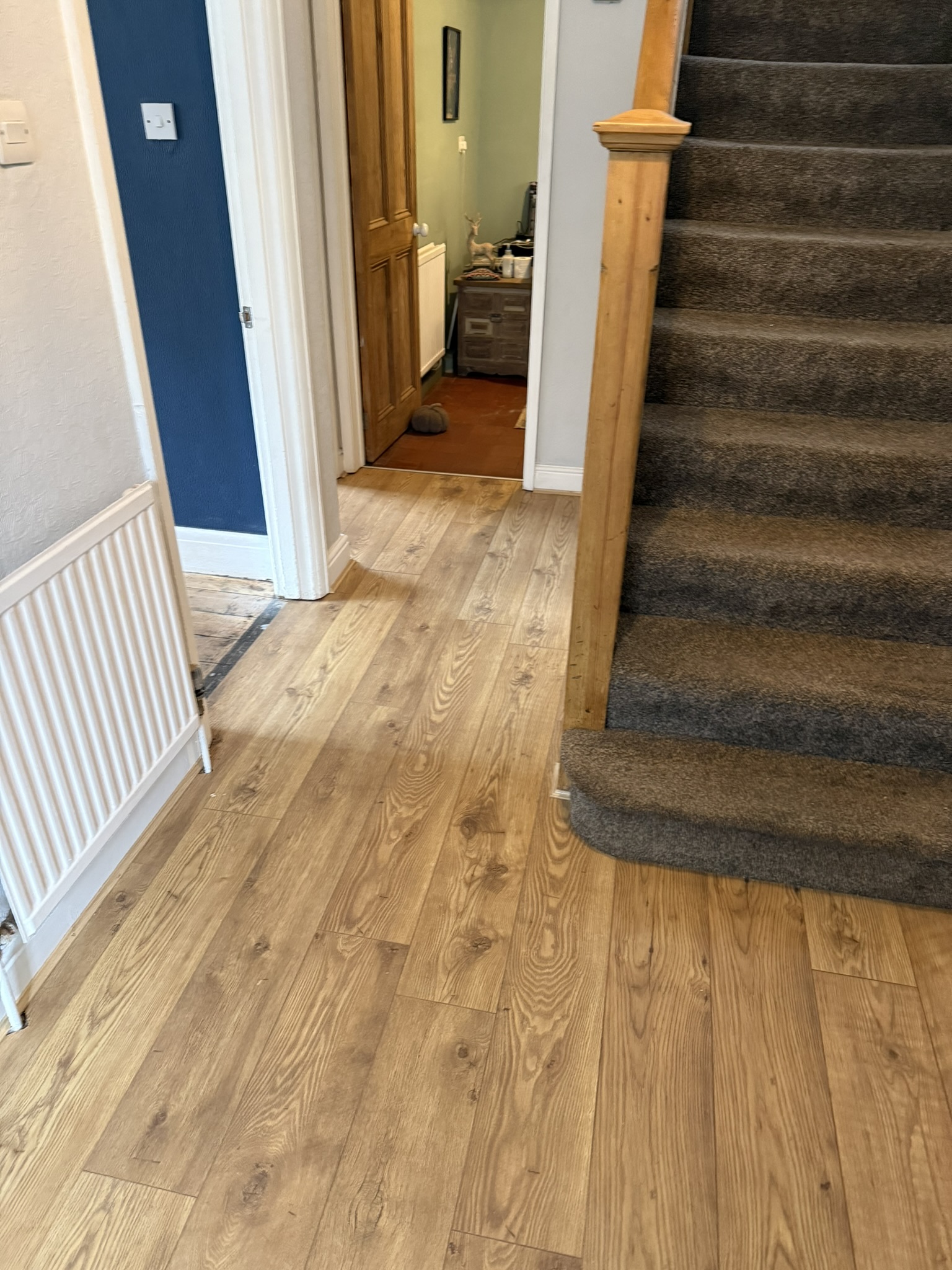 Newly fitted skirting and laminate floor in a finished room
